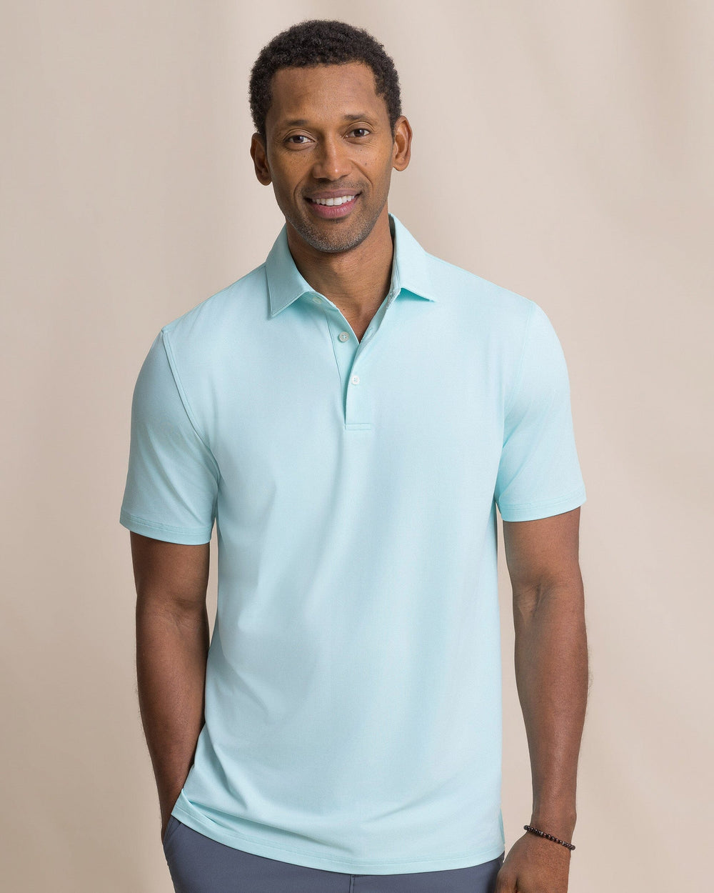 The front view of the Southern Tide Coastal Breeze® Heather Performance Polo by Southern Tide - Heather Shore Blue