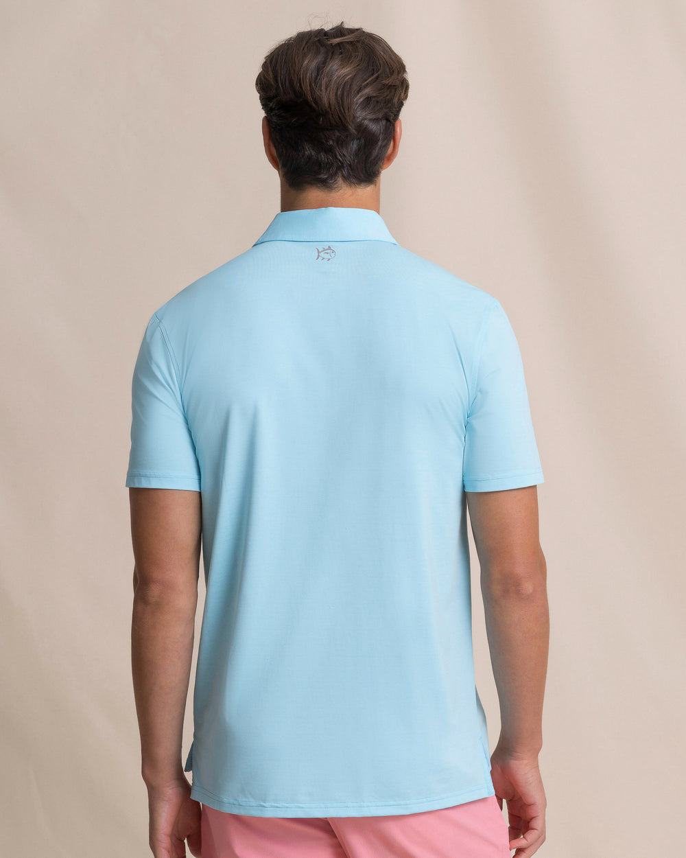 The back view of the Southern Tide Coastal Breeze® Heather Performance Polo by Southern Tide - Heather Tropical Breeze Blue