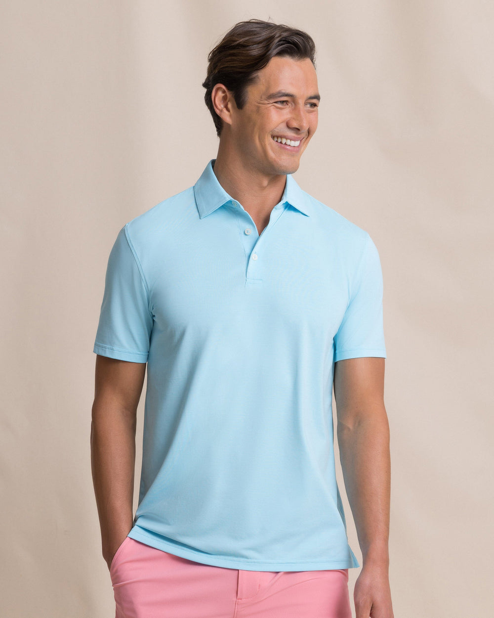 The front view of the Southern Tide Coastal Breeze® Heather Performance Polo by Southern Tide - Heather Tropical Breeze Blue