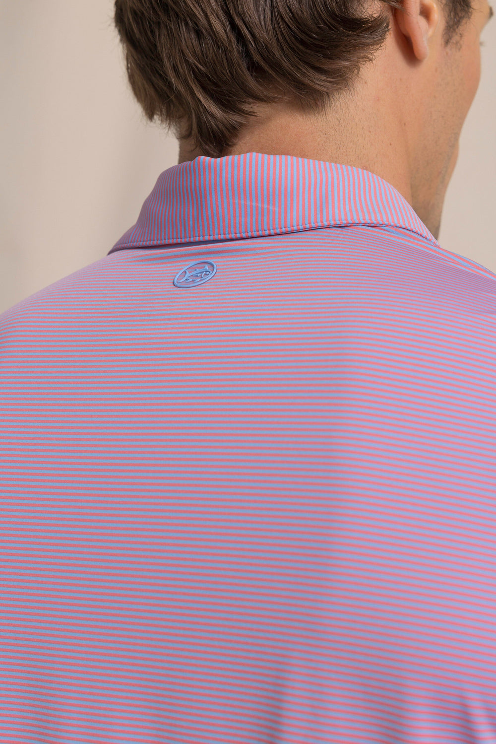 The detail view of the Southern Tide Coastal Breeze® Meadowbrook Stripe Performance Polo by Southern Tide - Coral Beach