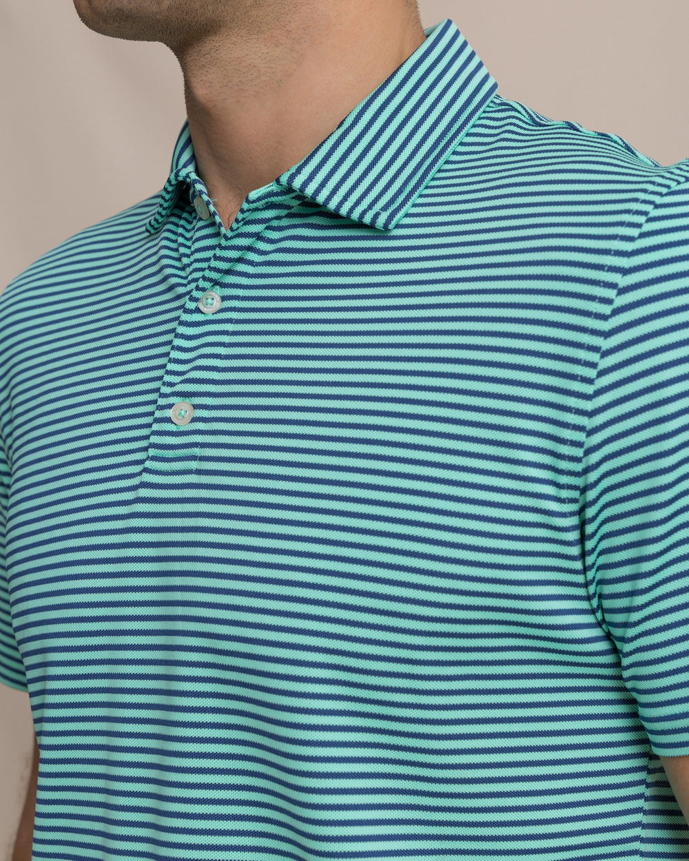 The detail view of the Southern Tide Coastal Breeze® Oceanfront Stripe Pique Performance Polo by Southern Tide - Gulf Shores