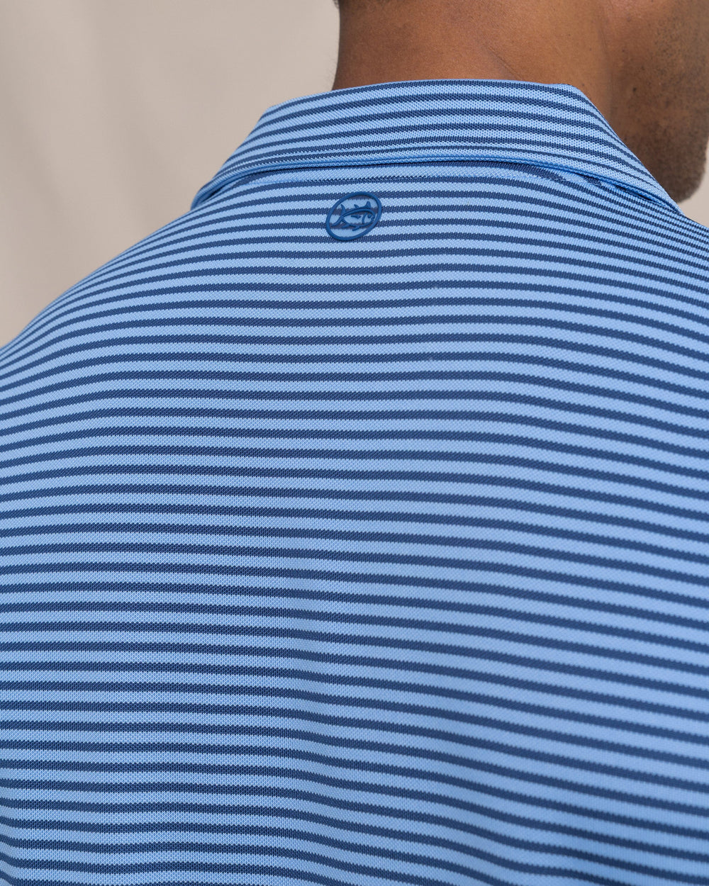 The detail view of the Southern Tide Coastal Breeze® Oceanfront Stripe Pique Performance Polo by Southern Tide - Ocean Channel