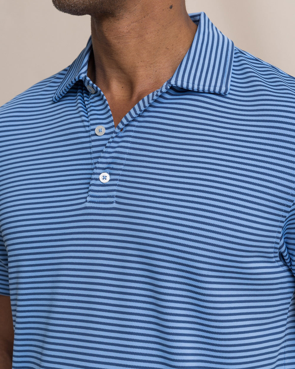 The detail view of the Southern Tide Coastal Breeze® Oceanfront Stripe Pique Performance Polo by Southern Tide - Ocean Channel