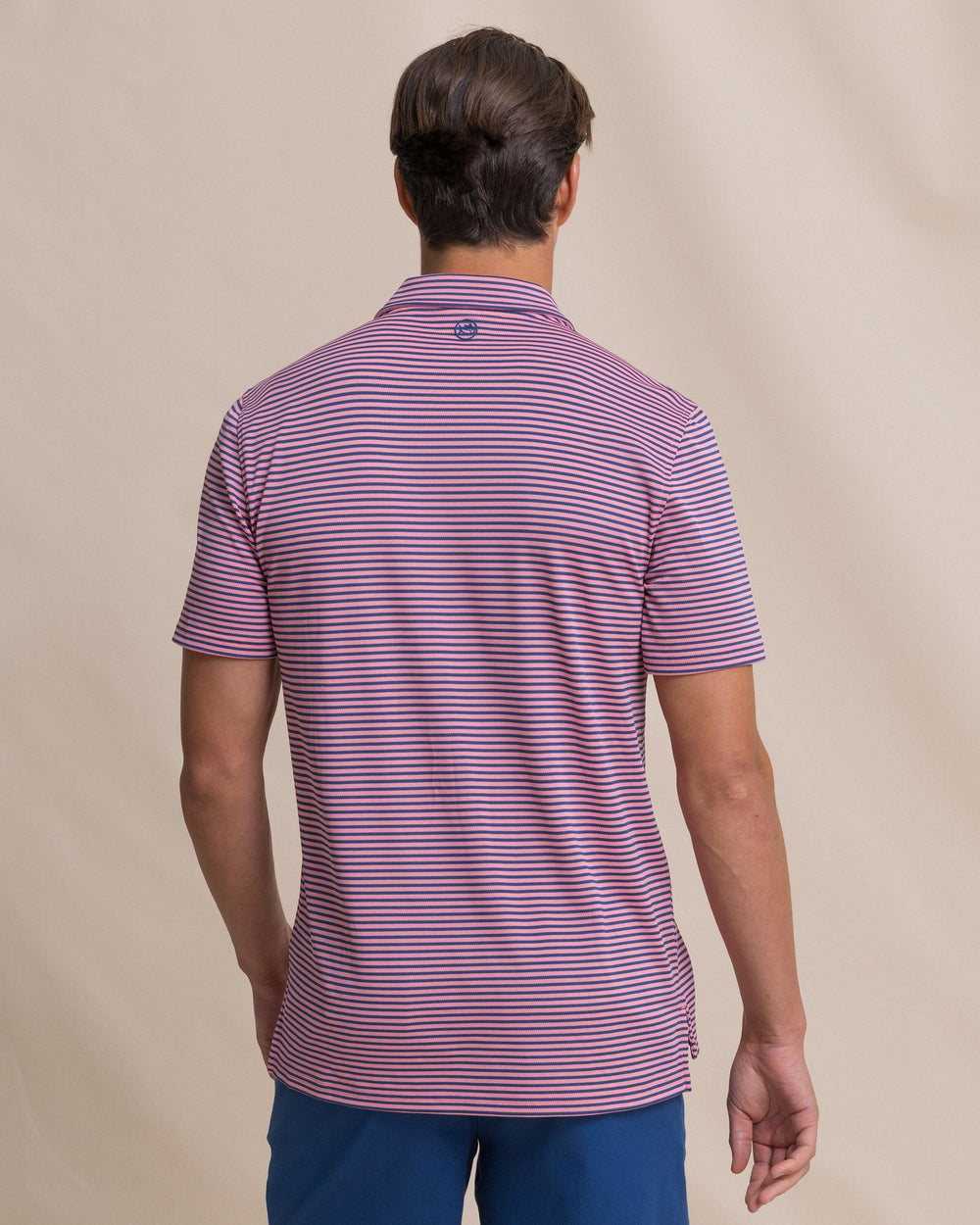 The back view of the Southern Tide Coastal Breeze® Oceanfront Stripe Pique Performance Polo by Southern Tide - Sea Pink
