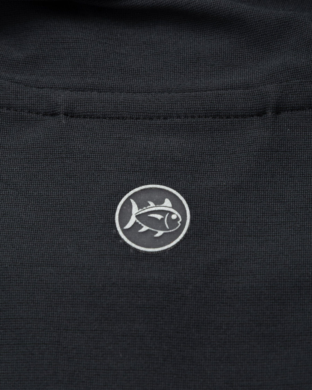 The detail view of the Southern Tide Coastal Breeze® Performance Hoodie by Southern Tide - Caviar Black