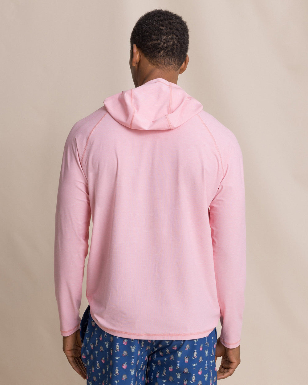 The back view of the Southern Tide Coastal Breeze® Performance Hoodie by Southern Tide - Sea Pink