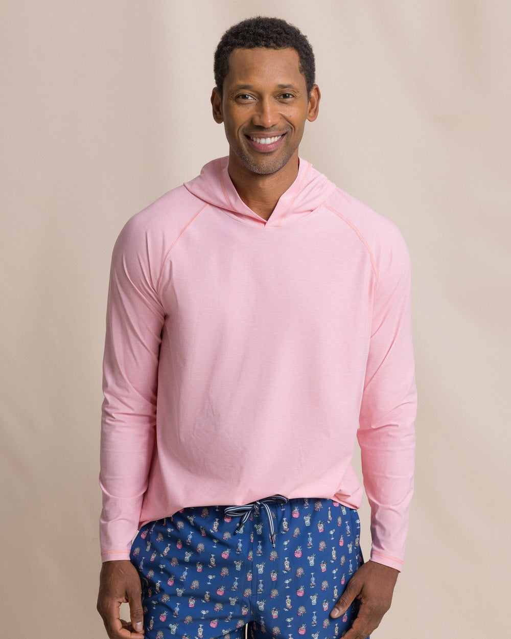 The front view of the Southern Tide Coastal Breeze® Performance Hoodie by Southern Tide - Sea Pink