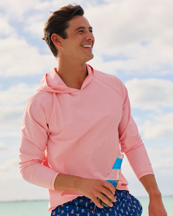 The lifestyle view of the Southern Tide Coastal Breeze® Performance Hoodie by Southern Tide - Sea Pink