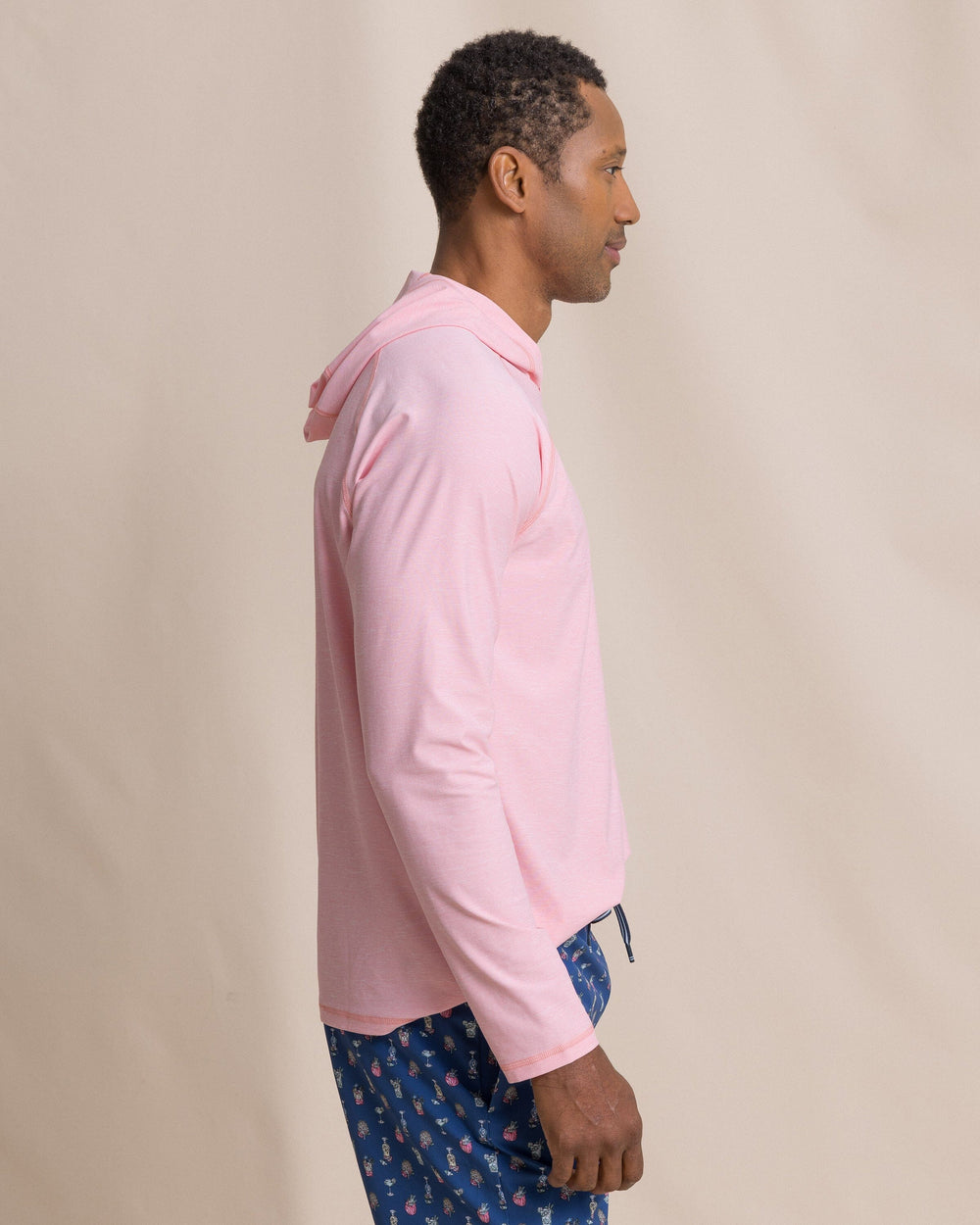 The side view of the Southern Tide Coastal Breeze® Performance Hoodie by Southern Tide - Sea Pink
