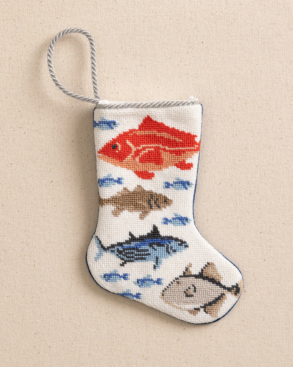 The front view of the Southern Tide Coastal Catch Needlepoint Stocking by Southern Tide - White