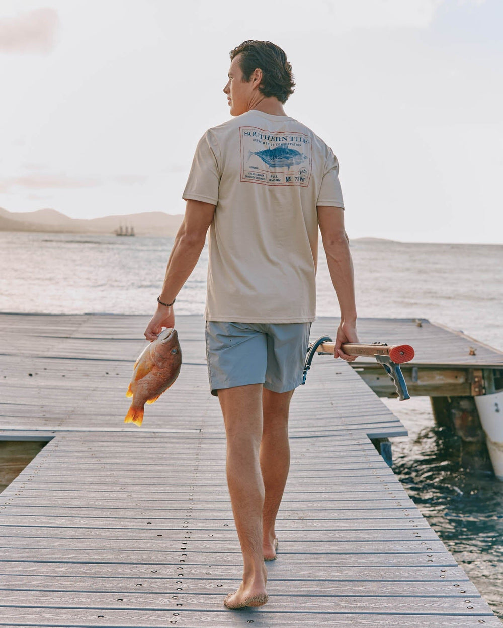 The front view of the Southern Tide Coastal Fishing License Short Sleeve T-Shirt by Southern Tide - Irish Cream