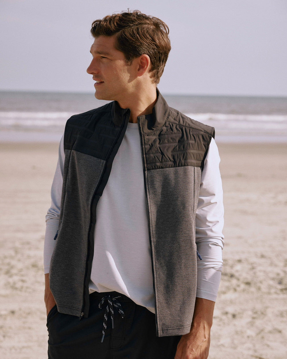 The lifestyle view of the Southern Tide Coligny Quilted Vest by Southern Tide - Caviar Black