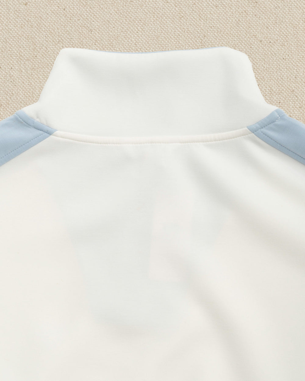 The back detail view of the Southern Tide Colorblock Lounge Quarter Zip by Southern Tide - Star White