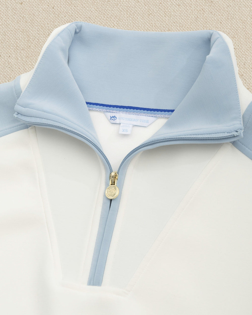 The front detail view of the Southern Tide Colorblock Lounge Quarter Zip by Southern Tide - Star White