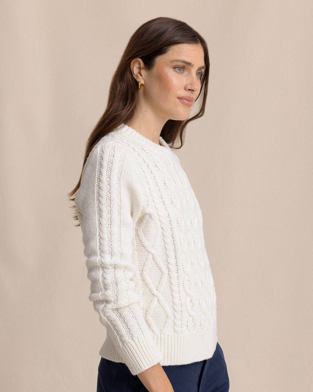 The side view of the Southern Tide Connie Cable Knit Sweater by Southern Tide - Sand White