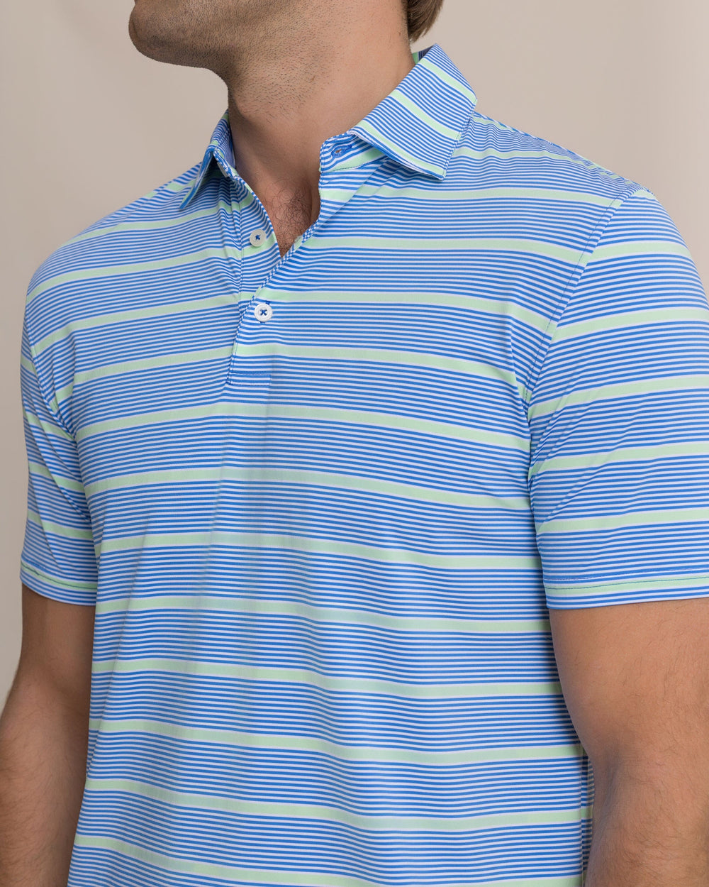 The detail view of the Southern Tide Core Sound Stripe Coastal Breeze® Performance Polo by Southern Tide - Blue Stream