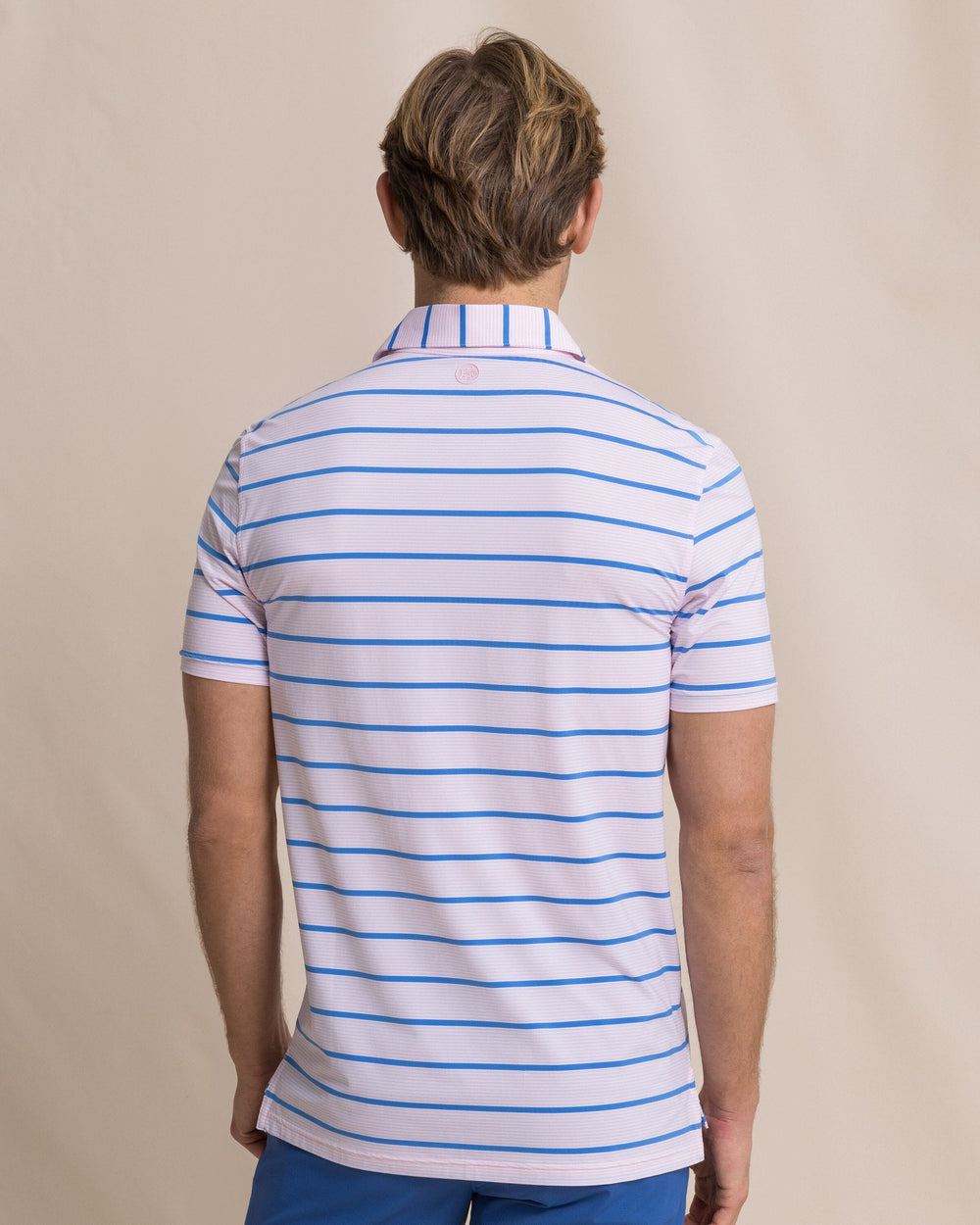 The back view of the Southern Tide Core Sound Stripe Coastal Breeze® Performance Polo by Southern Tide - Orchid Pink