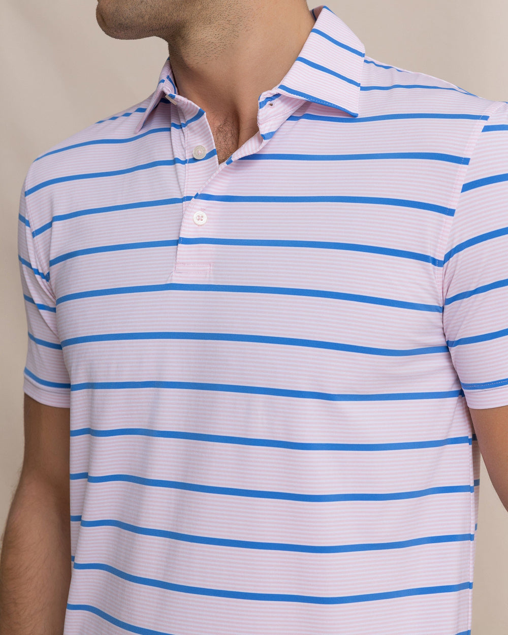 The detail view of the Southern Tide Core Sound Stripe Coastal Breeze® Performance Polo by Southern Tide - Orchid Pink