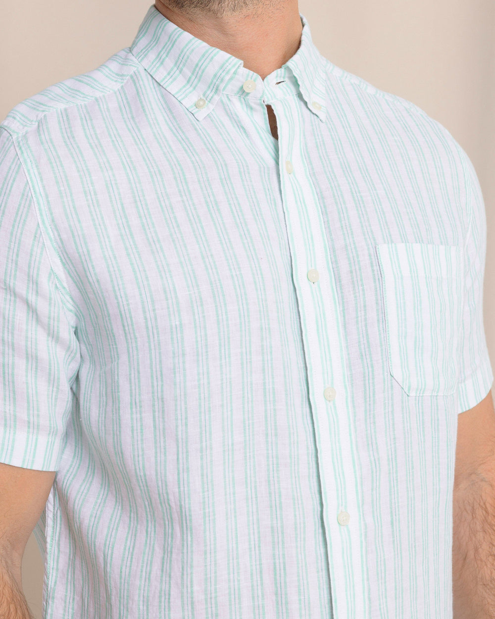 The front detail view of the Southern Tide Crepe Myrtle Striped Linen Short Sleeve Sport Shirt by Southern Tide - Jade Green