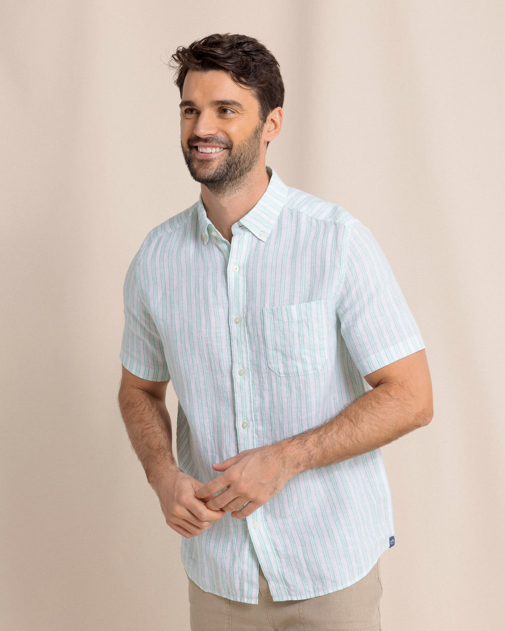 The front side view of the Southern Tide Crepe Myrtle Striped Linen Short Sleeve Sport Shirt by Southern Tide - Jade Green