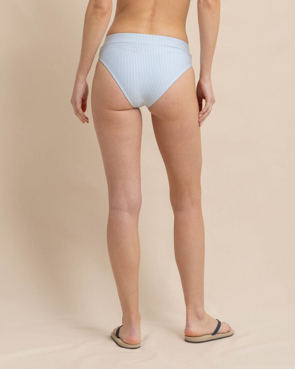 The back view of the Southern Tide Cross Over Bikini Bottom in Seersucker by Southern Tide - Clearwater Blue