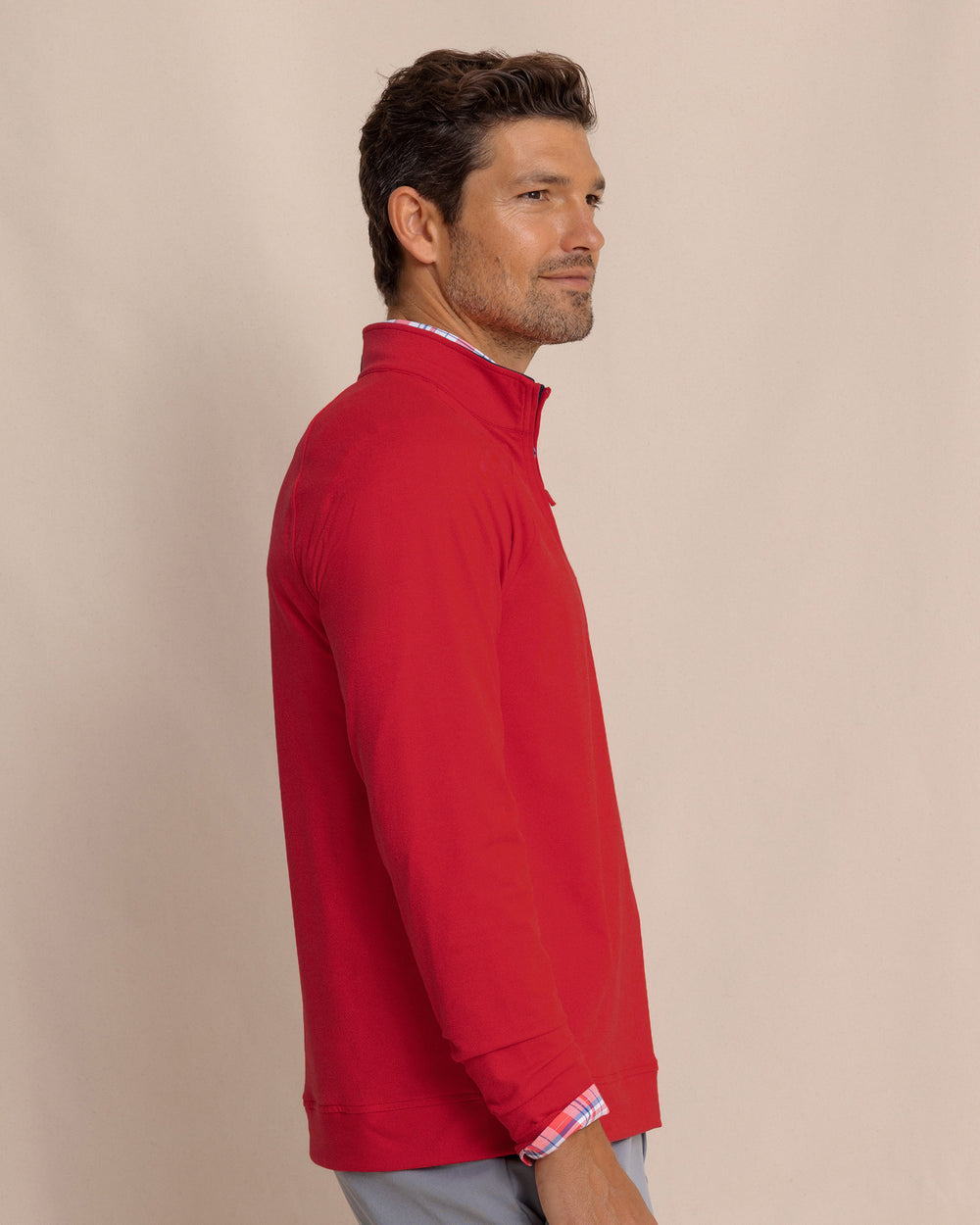 The side view of the Southern Tide Cruiser Heather Quarter Zip Pullover by Southern Tide - Heather Crab Red