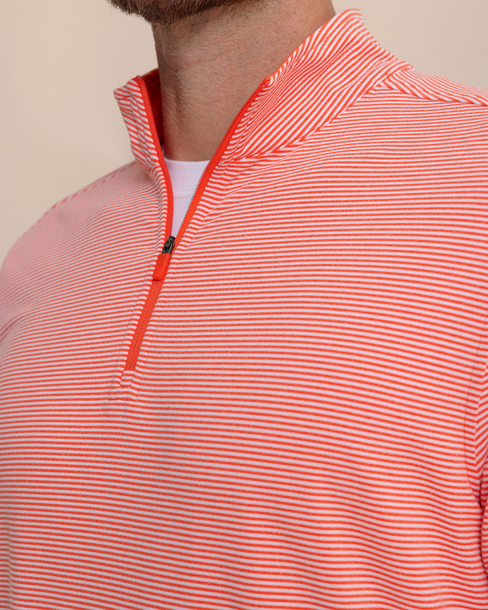 The detail view of the Southern Tide Cruiser Micro-Stripe Heather Quarter Zip by Southern Tide - Heather Endzone Orange