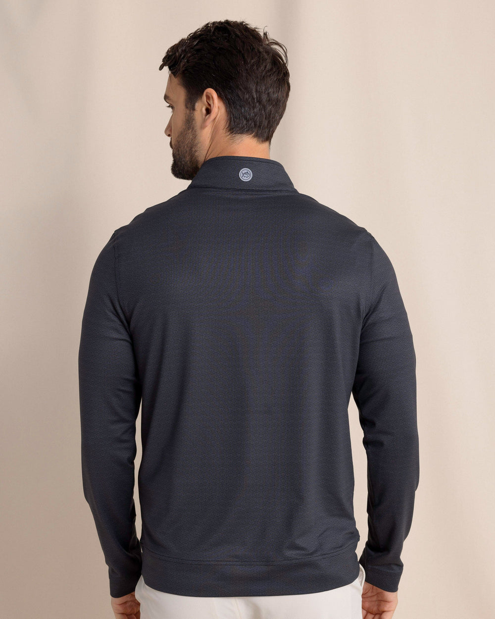 The back view of the Southern Tide Cruiser ST Geo Printed Quarter Zip by Southern Tide - Caviar Black