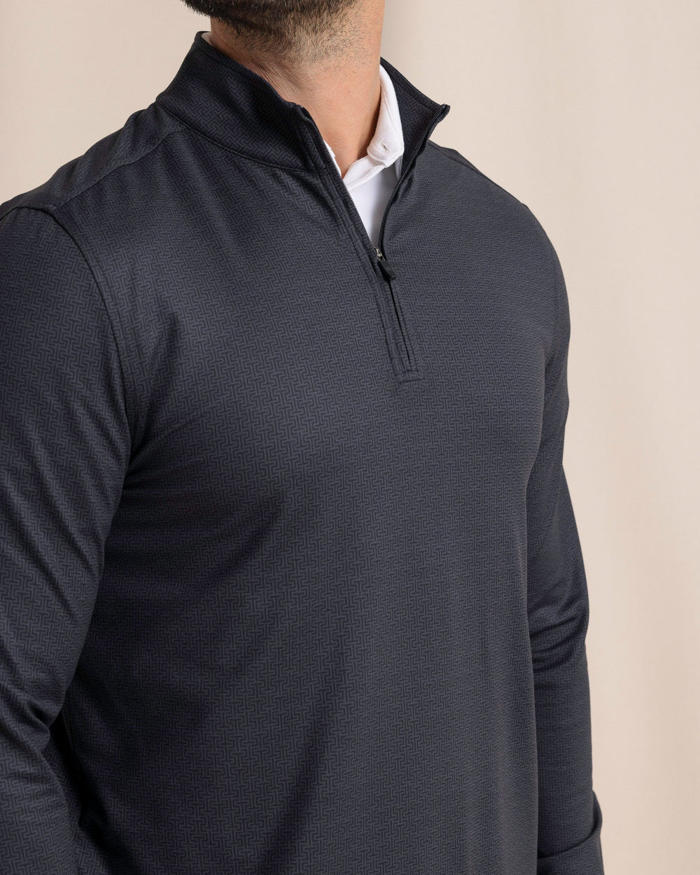 The front detail view of the Southern Tide Cruiser ST Geo Printed Quarter Zip by Southern Tide - Caviar Black