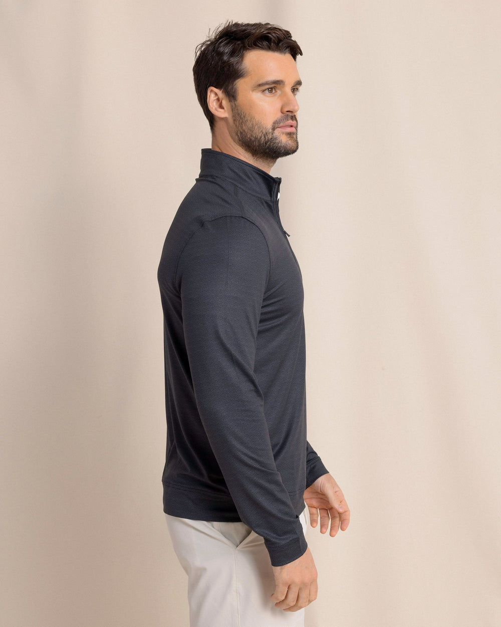 The side view of the Southern Tide Cruiser ST Geo Printed Quarter Zip by Southern Tide - Caviar Black