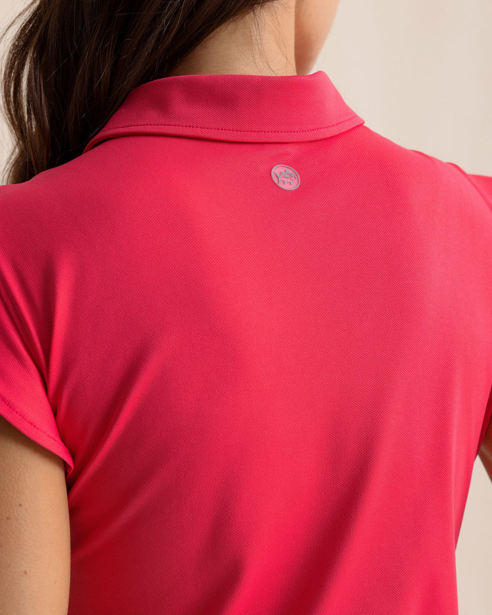 The back detail view of the Southern Tide Dayna Active Ruffle Polo Tank by Southern Tide - Calypso Berry