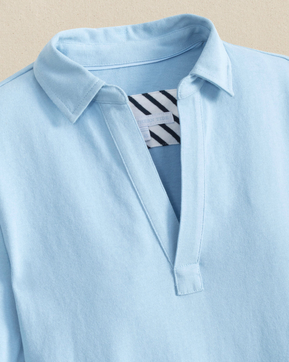 The detail view of the Southern Tide Demi Solid Short Sleeve Polo Dress by Southern Tide - Cerulean