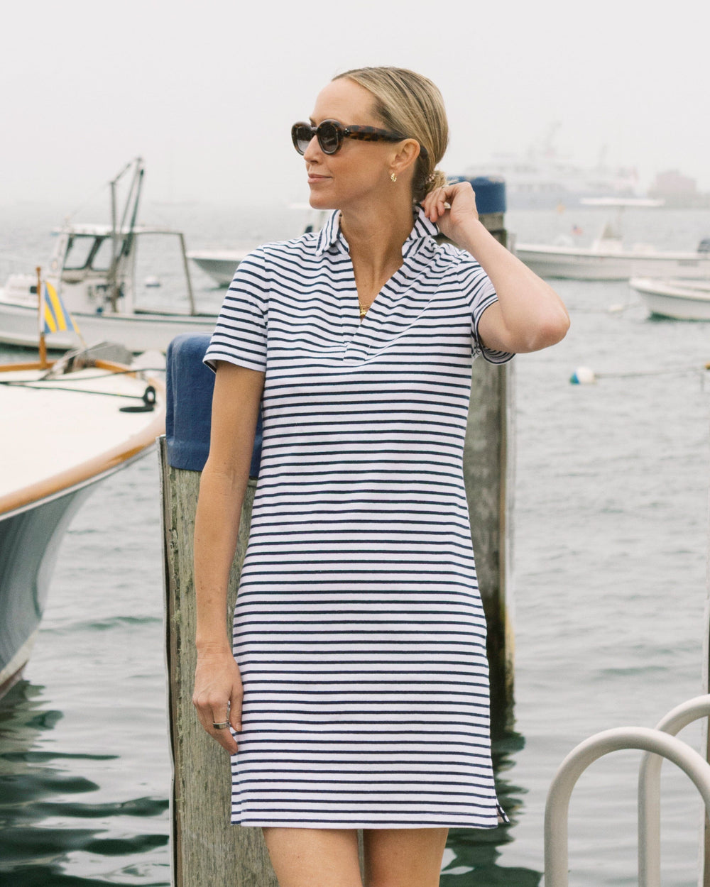 The lifestyle view of the Southern Tide Demi Stripe Short Sleeve Polo Dress by Southern Tide - Dress Blue