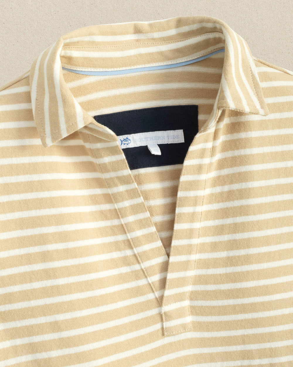 The detail view of the Southern Tide Demi Stripe Short Sleeve Polo Dress by Southern Tide - Irish Cream
