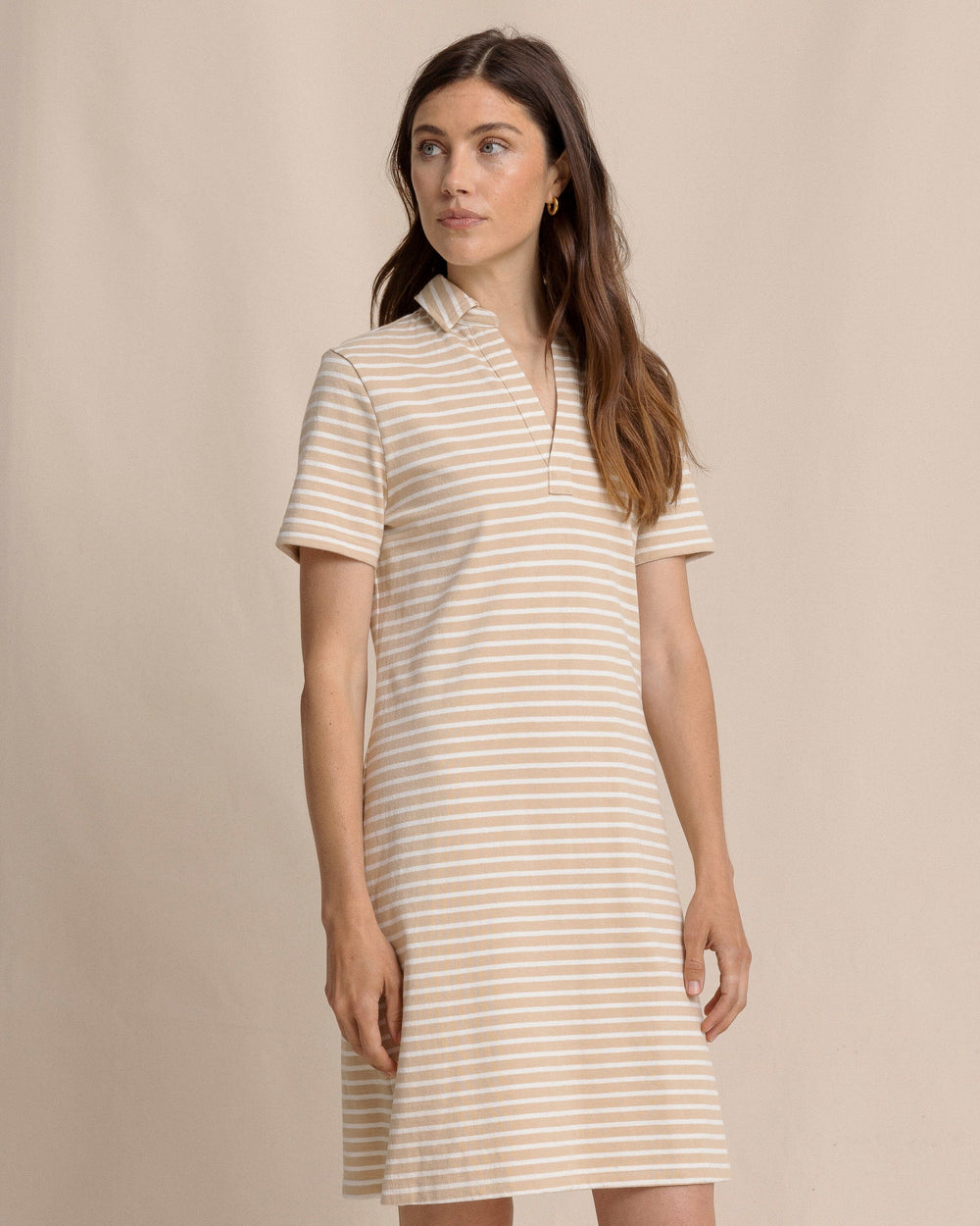 The front side view of the Southern Tide Demi Stripe Short Sleeve Polo Dress by Southern Tide - Irish Cream