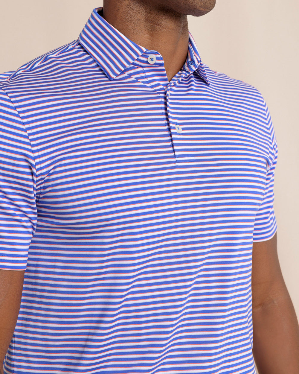 The front detail view of the Southern Tide Driver Caravel Stripe Polo by Southern Tide - Dazzling Blue