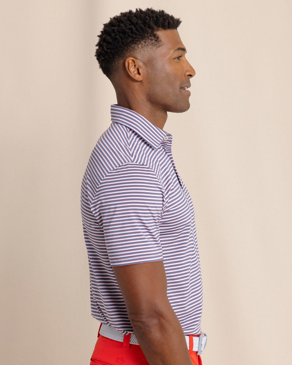 The side view of the Southern Tide Driver Caravel Stripe Polo by Southern Tide - Light Indigo