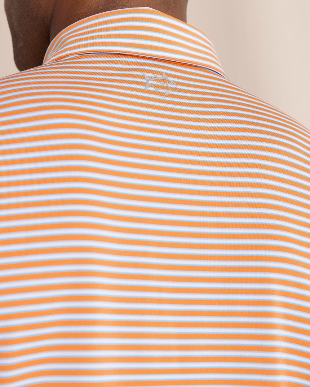 The back detail view of the Southern Tide Driver Caravel Stripe Polo by Southern Tide - Peach Parfait