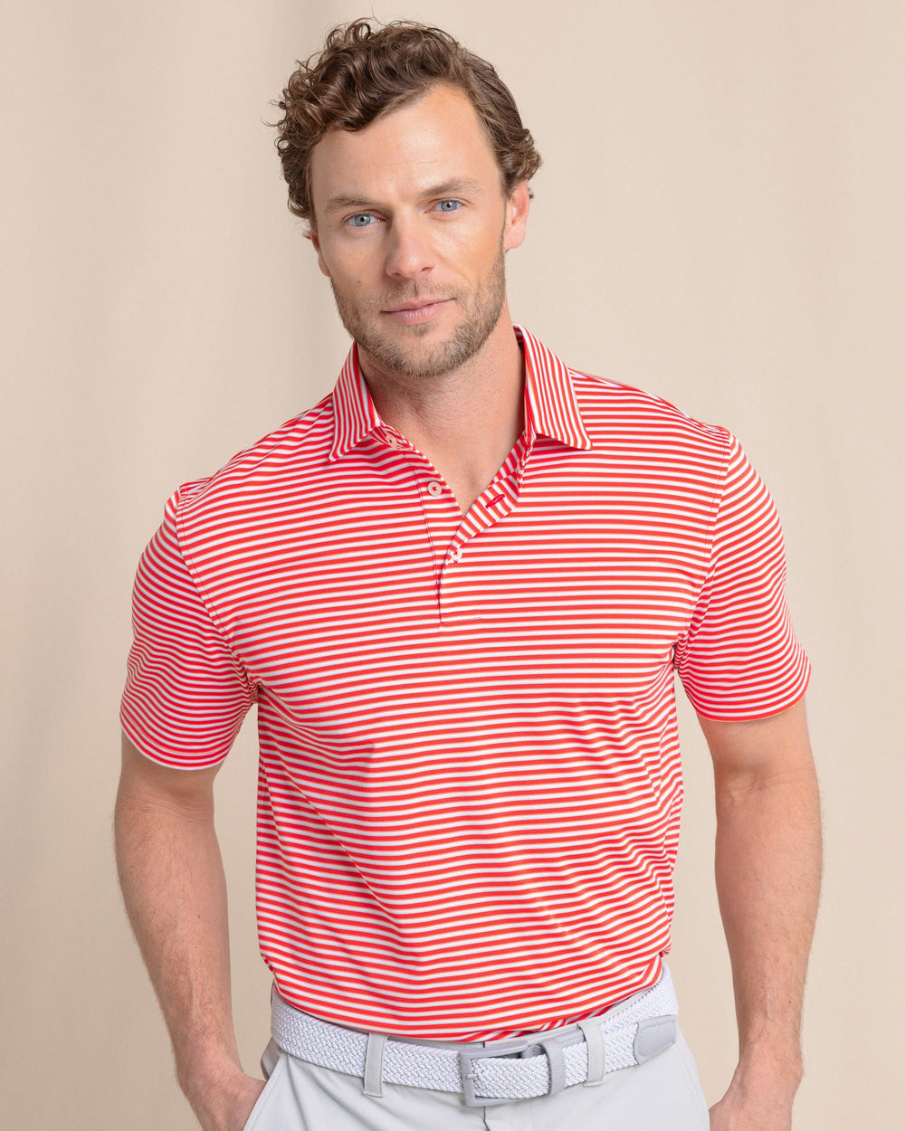 The front view of the Southern Tide Driver Caravel Stripe Polo by Southern Tide - Poppy Red