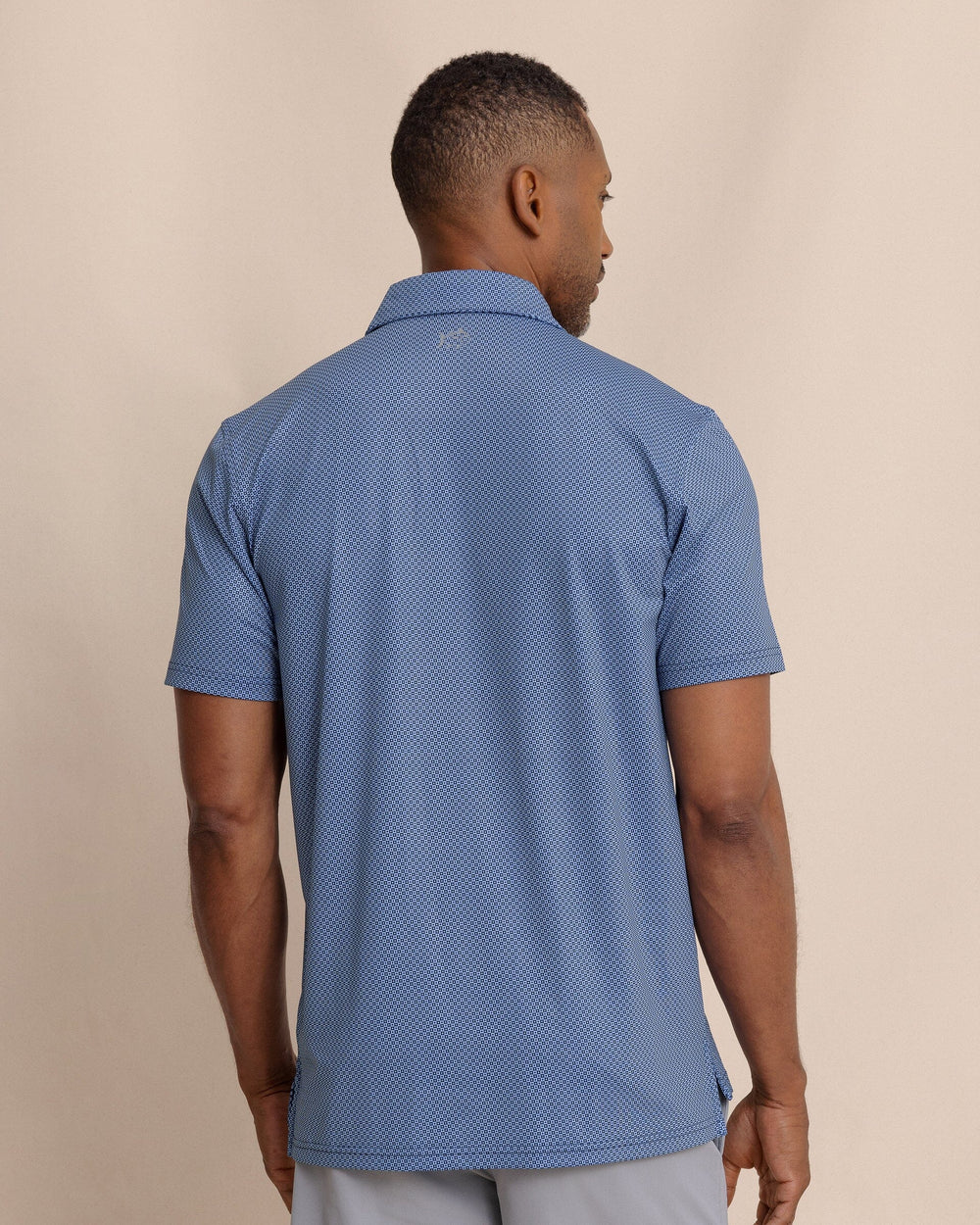 The back view of the Southern Tide Driver Coastal Geo Printed Polo by Southern Tide - Ocean Channel