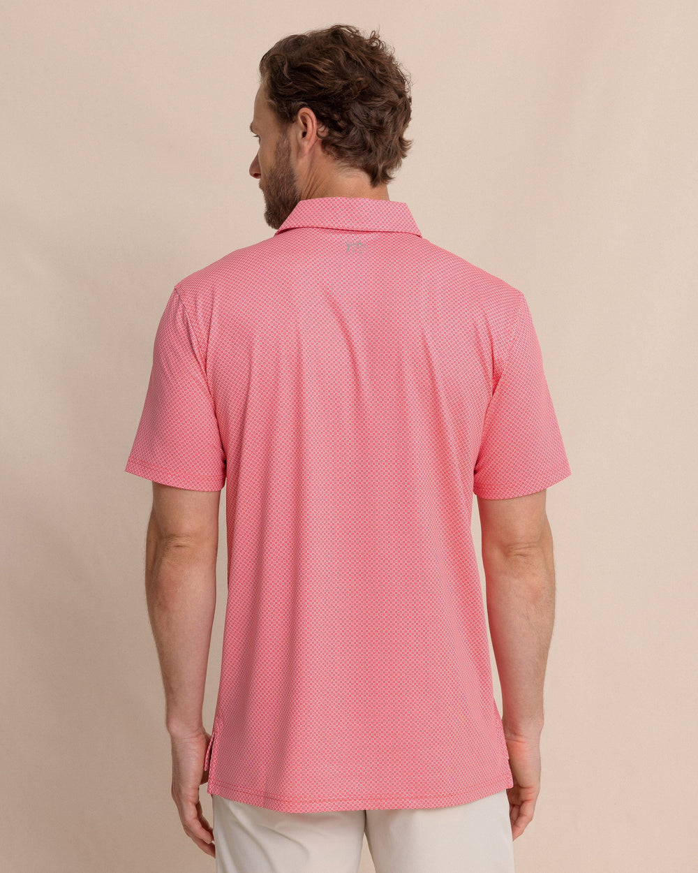 The back view of the Southern Tide Driver Coastal Geo Printed Polo by Southern Tide - Snapper
