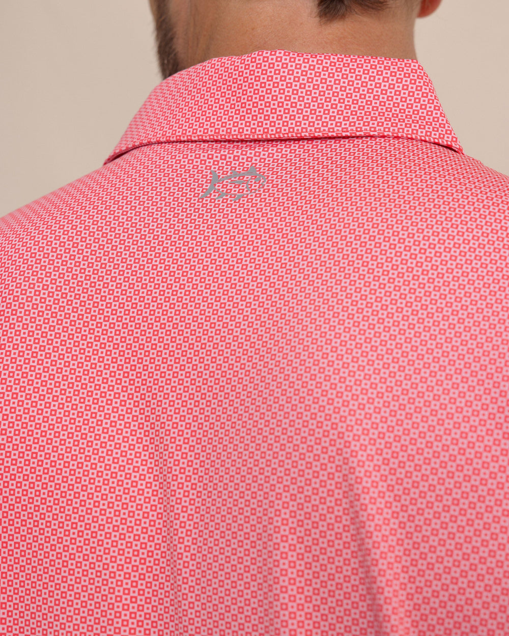 The detail view of the Southern Tide Driver Coastal Geo Printed Polo by Southern Tide - Snapper