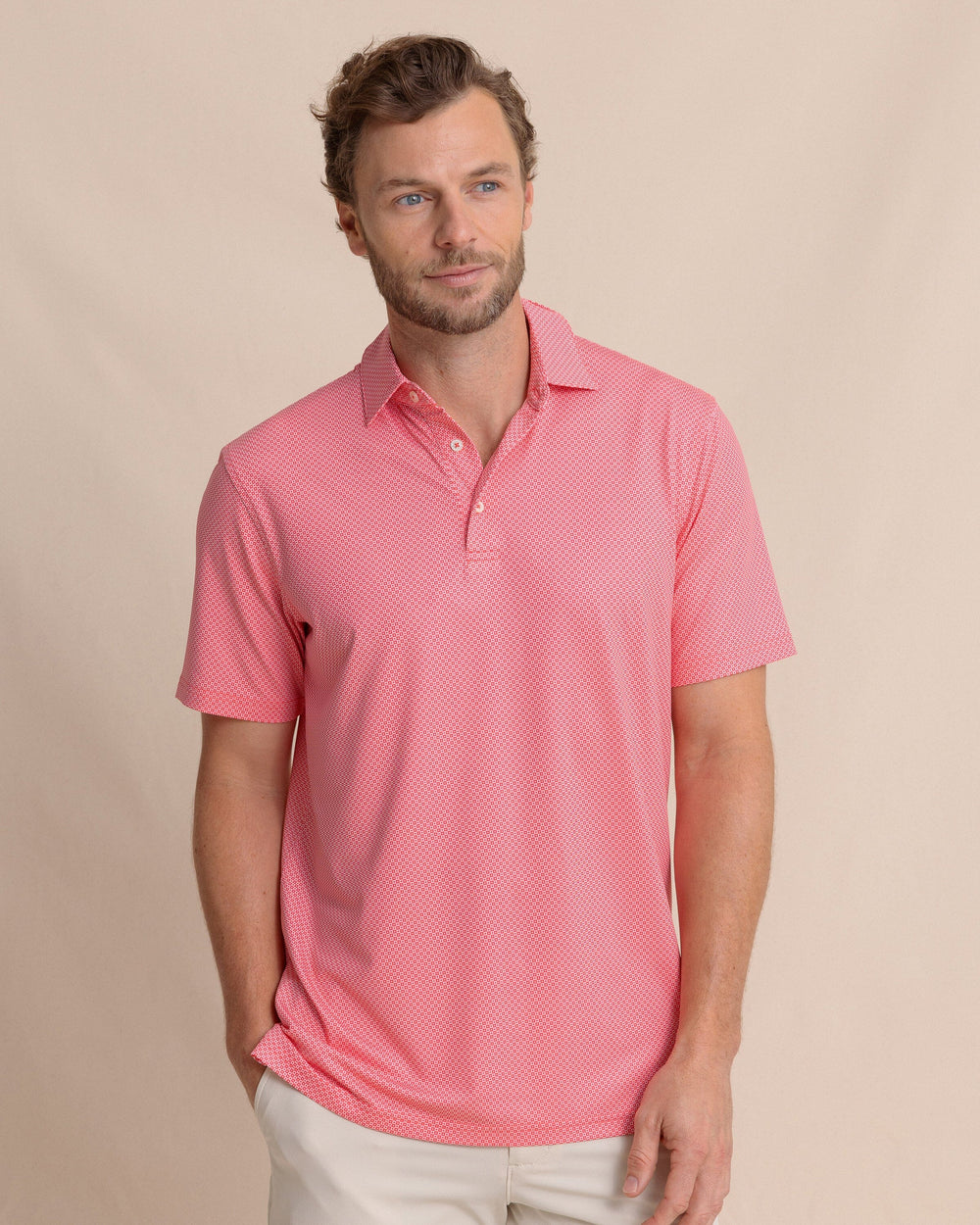 The front view of the Southern Tide Driver Coastal Geo Printed Polo by Southern Tide - Snapper
