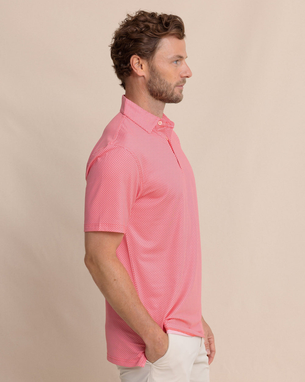 The side view of the Southern Tide Driver Coastal Geo Printed Polo by Southern Tide - Snapper