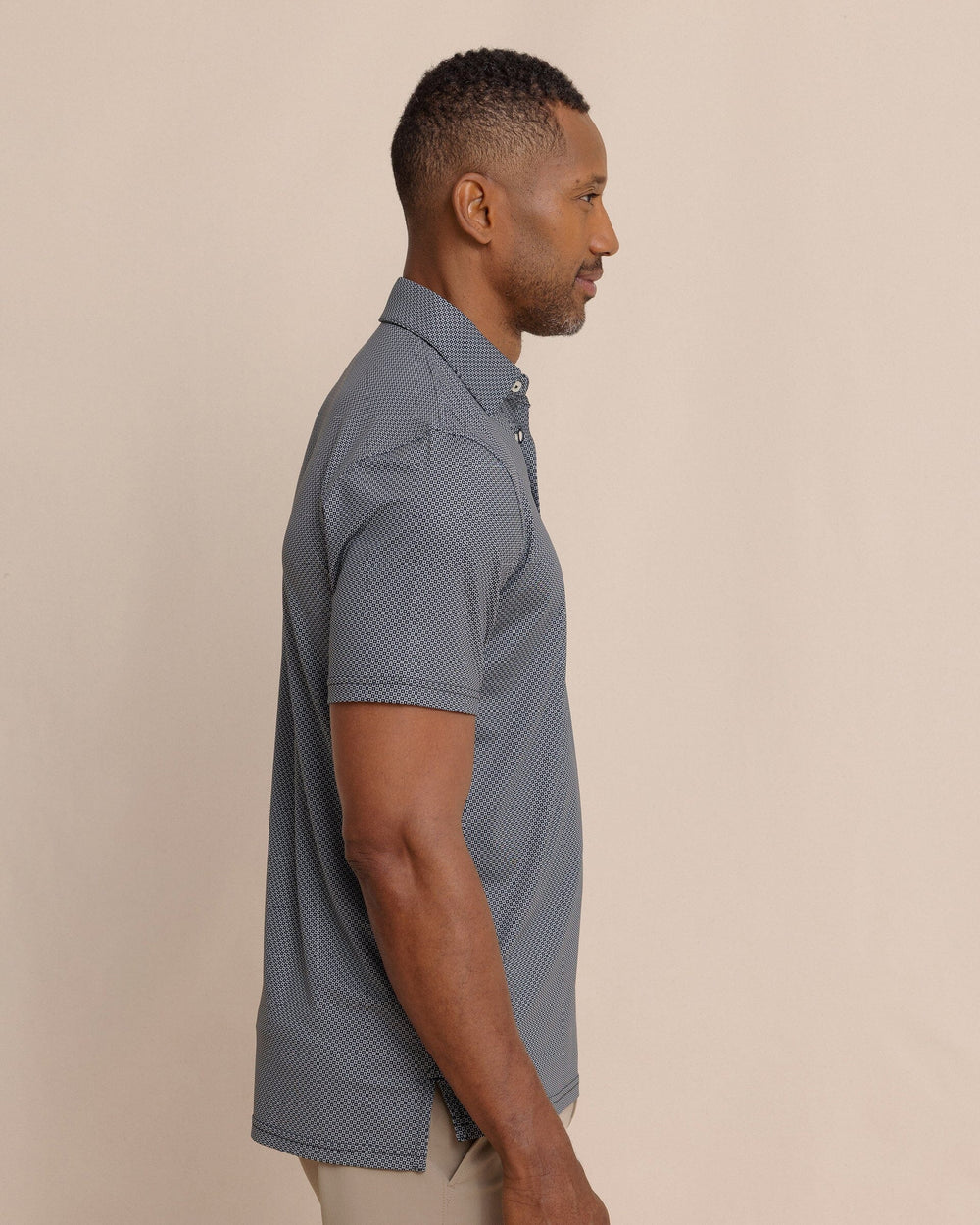 The side view of the Southern Tide Driver Coastal Geo Printed Polo by Southern Tide - Steel