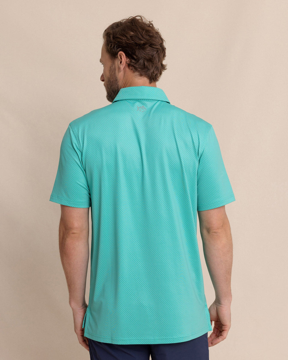 The back view of the Southern Tide Driver Coastal Geo Printed Polo by Southern Tide - Turtle Green