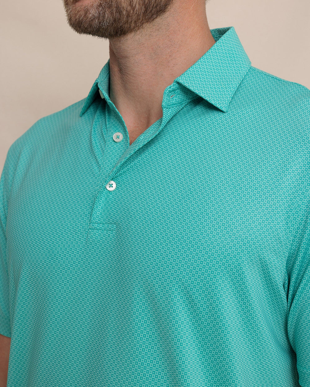 The detail view of the Southern Tide Driver Coastal Geo Printed Polo by Southern Tide - Turtle Green