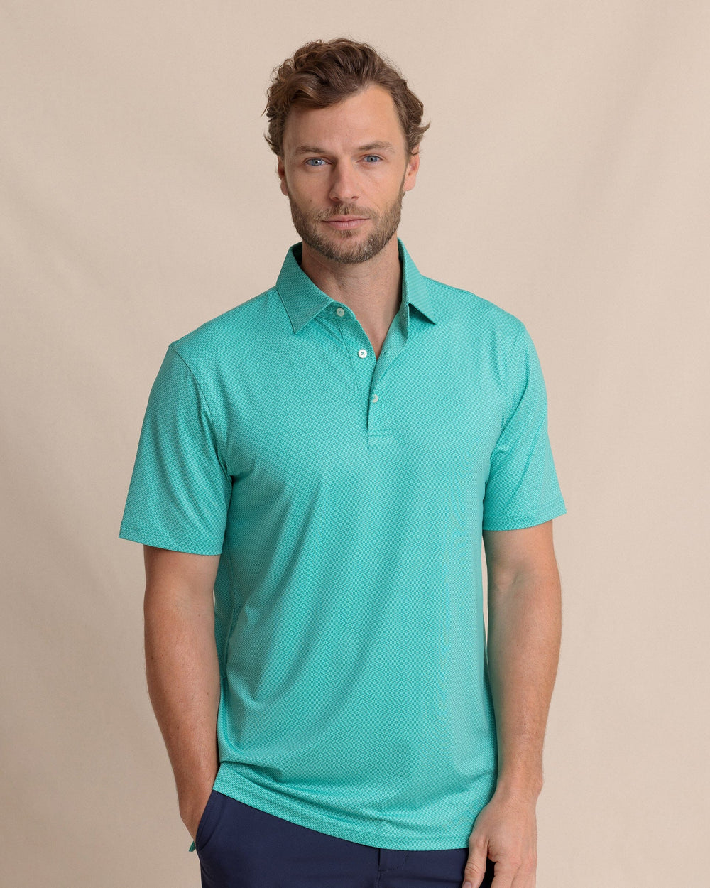 The front view of the Southern Tide Driver Coastal Geo Printed Polo by Southern Tide - Turtle Green