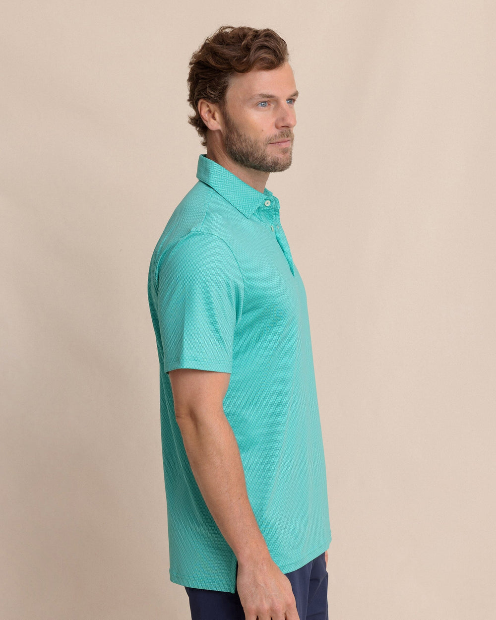 The side view of the Southern Tide Driver Coastal Geo Printed Polo by Southern Tide - Turtle Green
