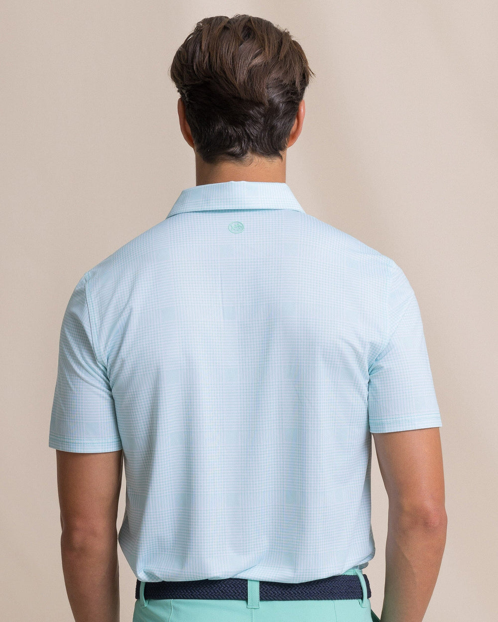 The back view of the Southern Tide Driver Coral Key Plaid Printed Polo by Southern Tide - Gulf Shores